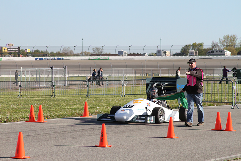 The Mountaineer Racing Formula SAE® Car taking the Green flag at the 2017 Formula SAE Michigan Competition